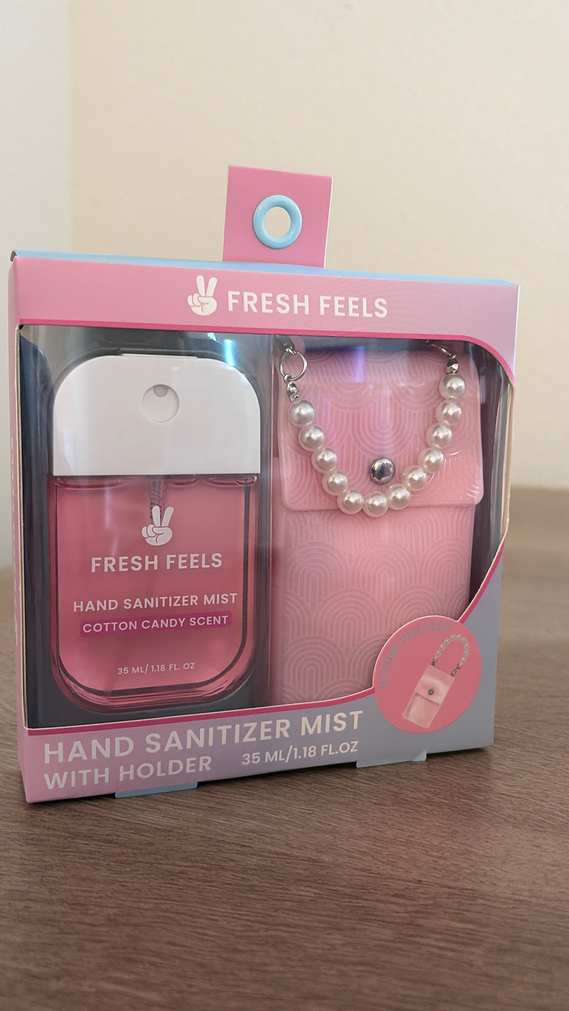 Hand sanitizer with holder